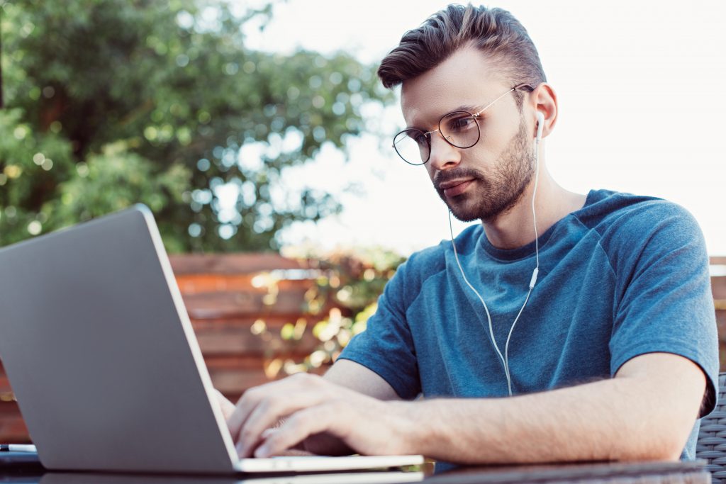 A person who is working at own laptop